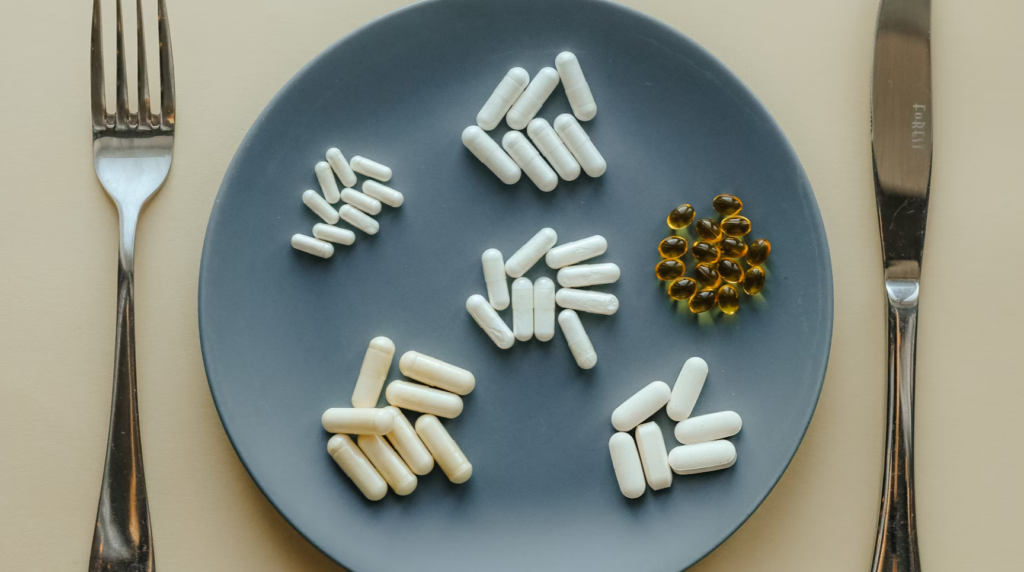 plate with piles of supplement pills